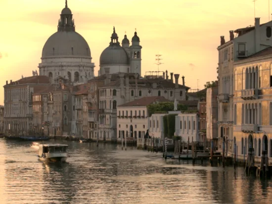 A merged HDR photo of the Venice skyline at sunset, holding detail from the bright sky down to the shadowed water